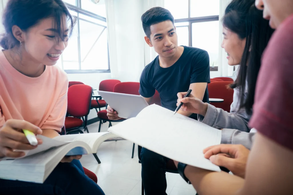 friends-discussing-while-sitting-classroom_11zon